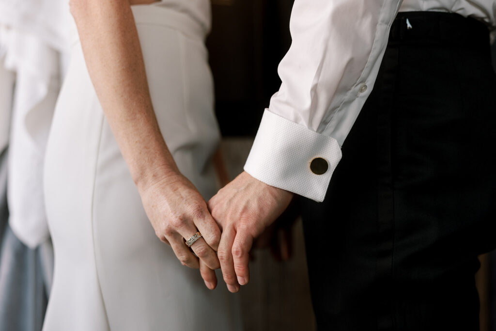Bride and groom holding hands at celestine wedding brooklyn