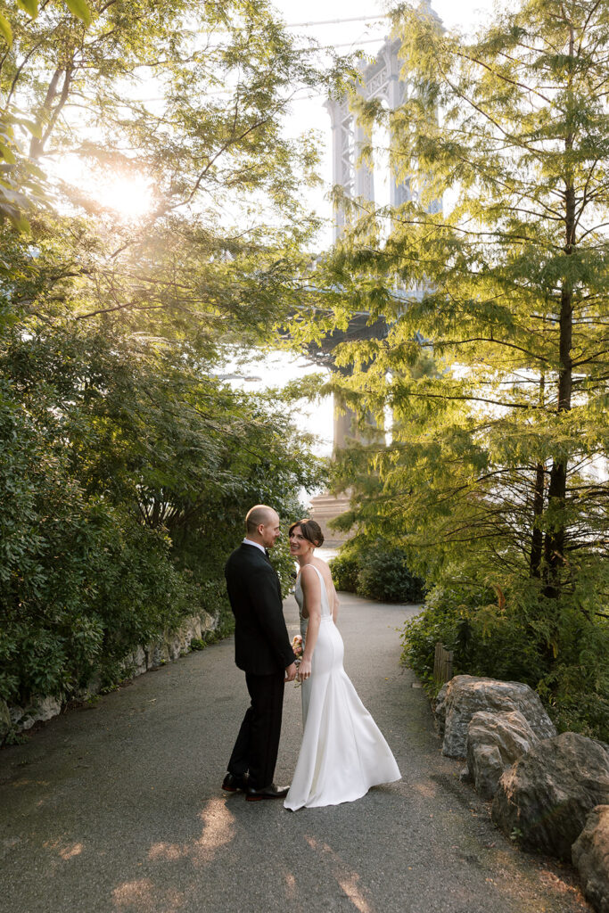bride and groom on bike path in NYC at Celestine Wedding