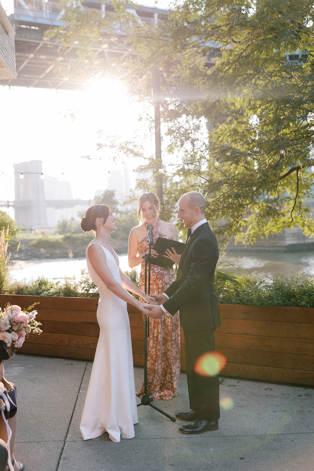 bride and groom holding hands for wedding ceremony at Celestine Wedding brooklyn