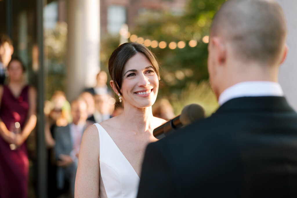 Bride smiling at groom at ceremony at Celestine Wedding brooklyn