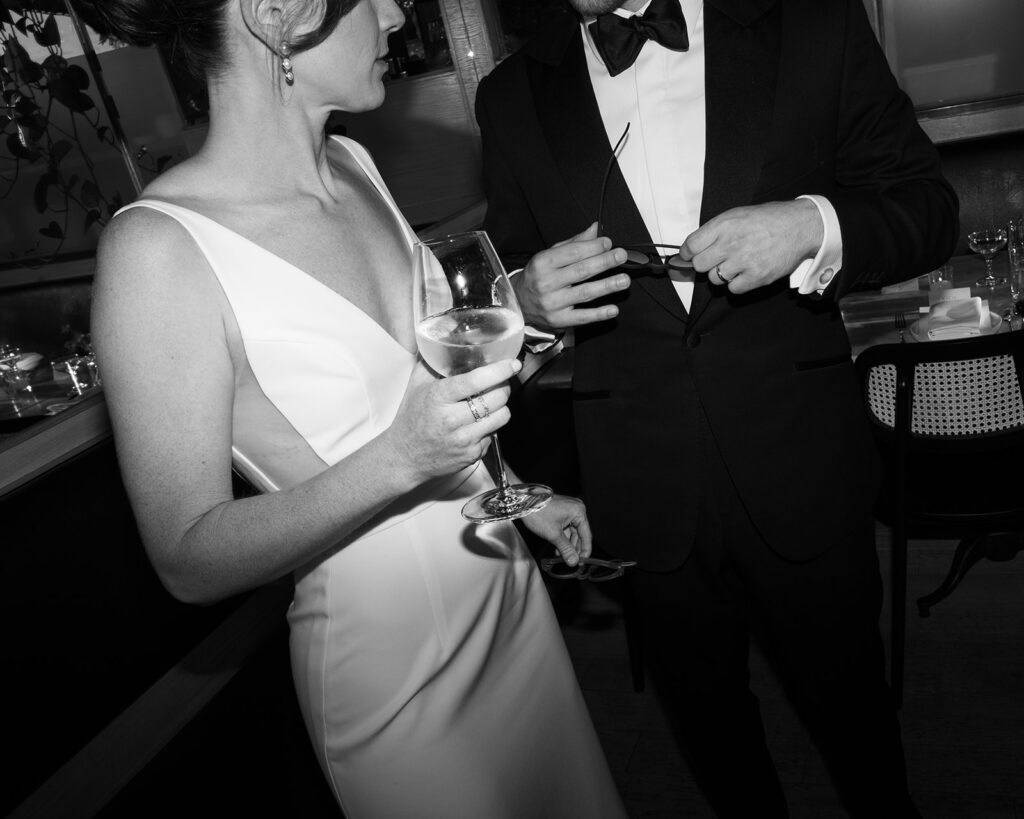 bride and groom holding drinks at celestine wedding brooklyn