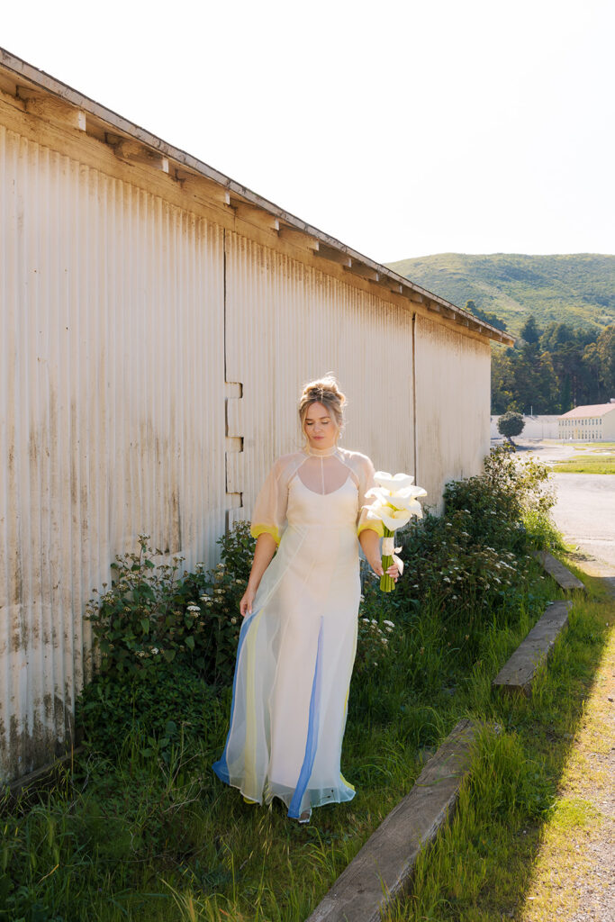 bride in front of boat house at san francisco wedding