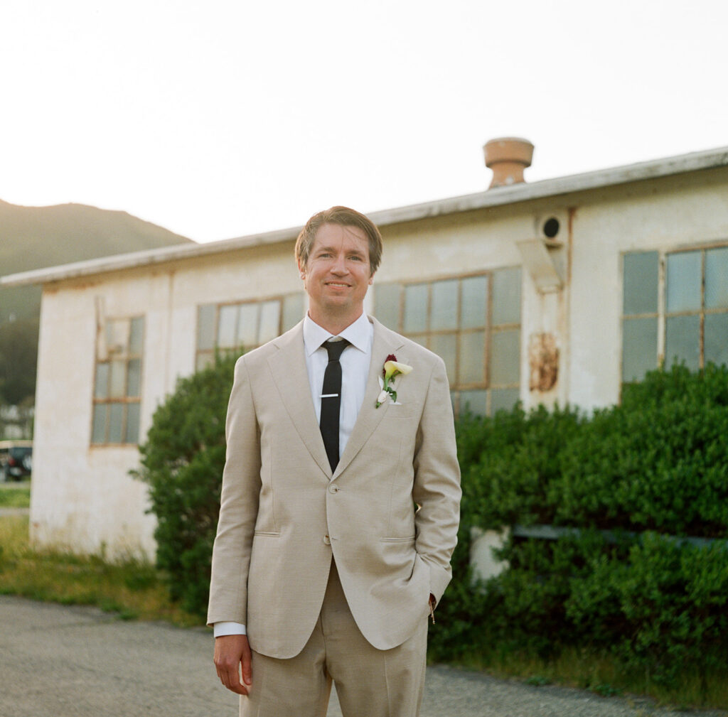 groom in front of boat house at san francisco wedding