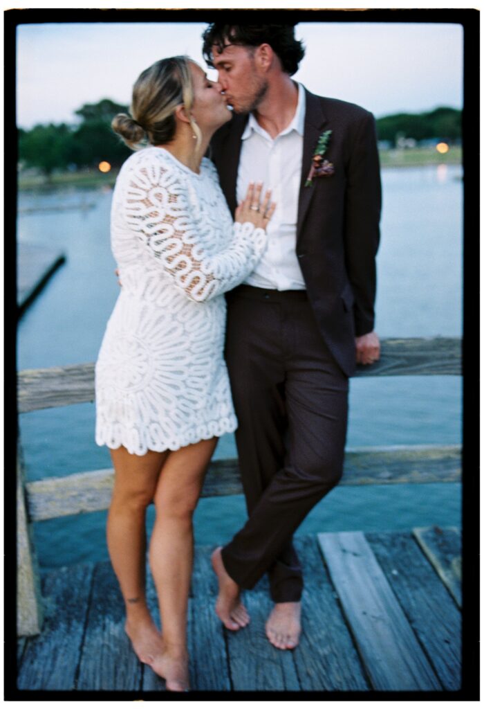 bride and groom kissing to show whalehead club events