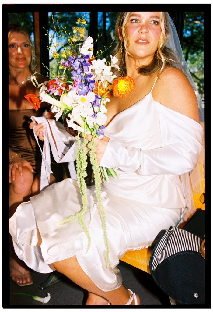 bride holding flowers before wedding at whalehead club nc