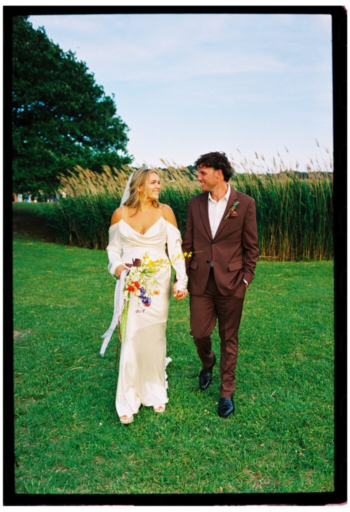 bride and groom at whalehead club nc looking at each other