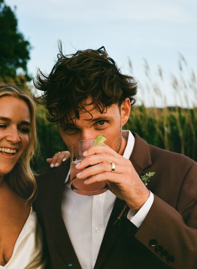 groom drinking at whalehead club events