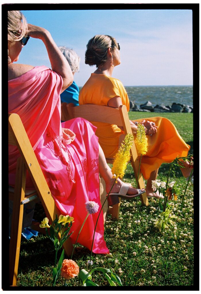 wedding guests sitting at whalehead club wedding