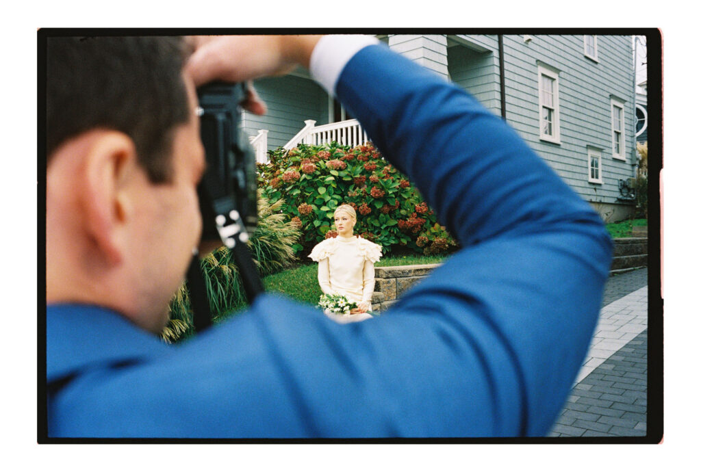 Groom photographing bride at Jersey Shore wedding at Parker House