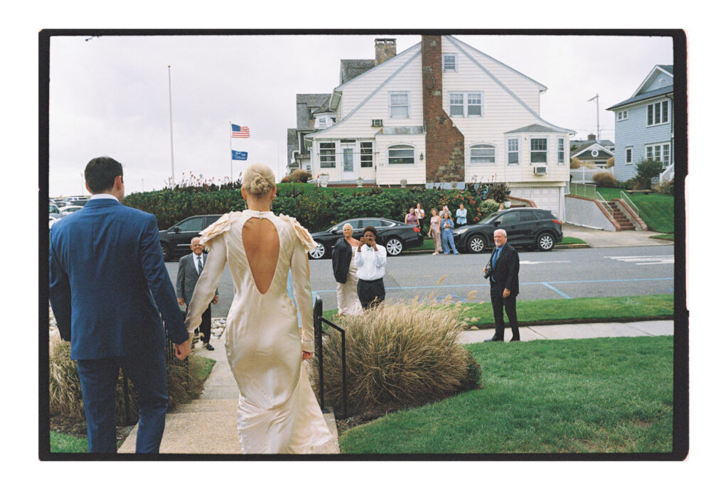 Couple walking out of the parker house for their wedding