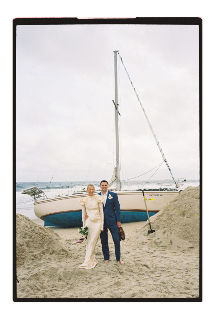 Jersey shore wedding portraits in front of old boat