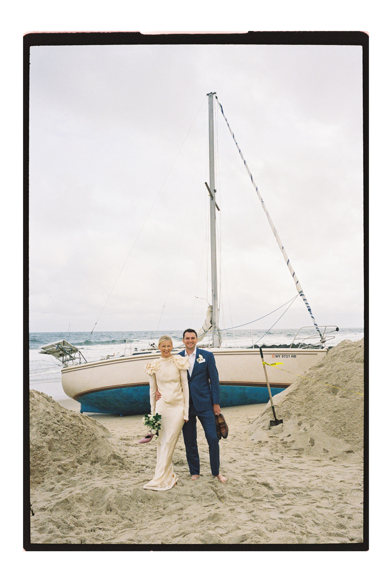 Jersey shore wedding portraits in front of old boat