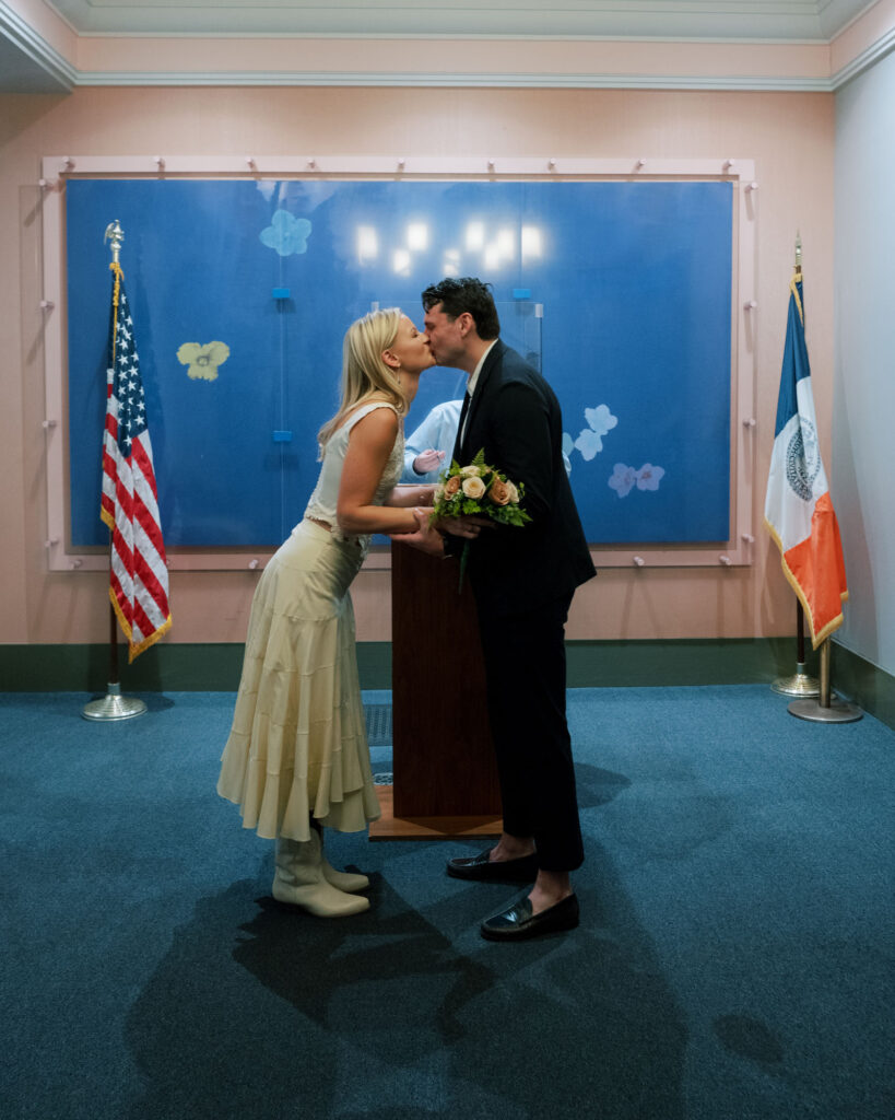 Holding hands during their NYC elopement at the courthouse