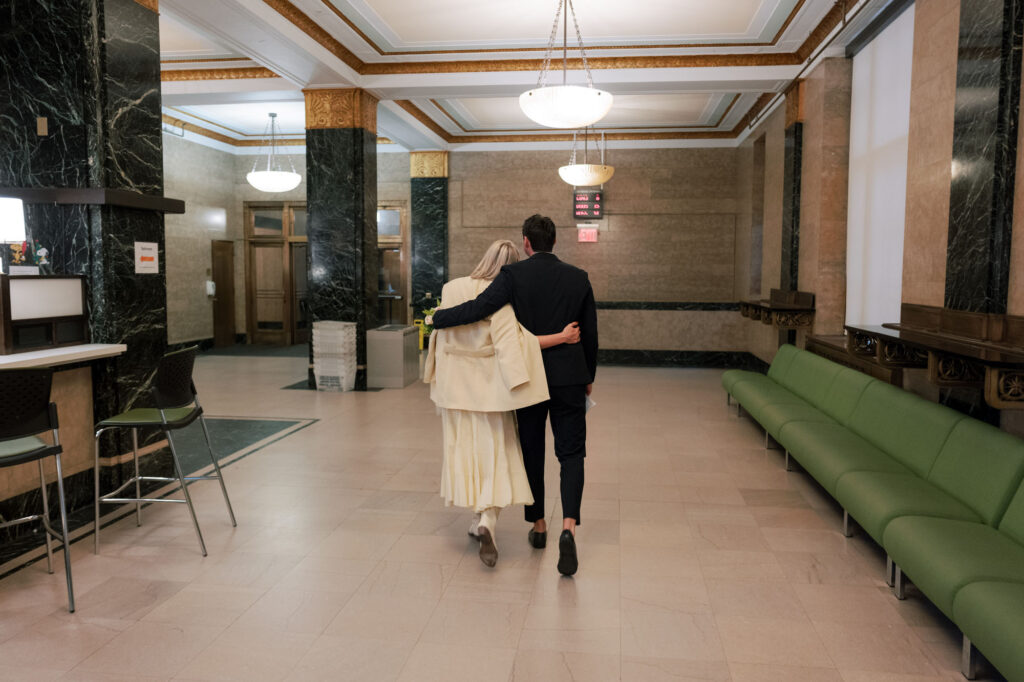 Holding hands during their NYC elopement at the courthouse