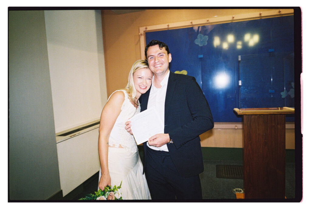 Newlyweds sharing a laugh after city hall elopement NYC