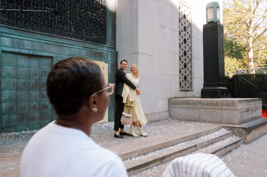 couple outside city hall after eloping in NYC