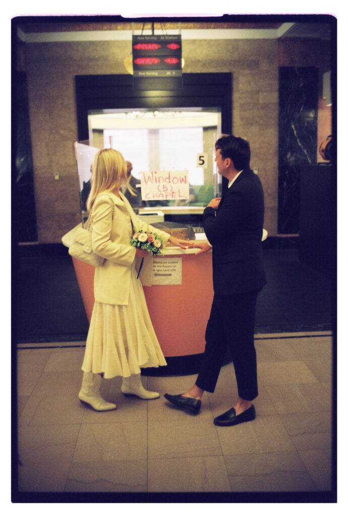 Holding hands during their NYC elopement at the courthouse
