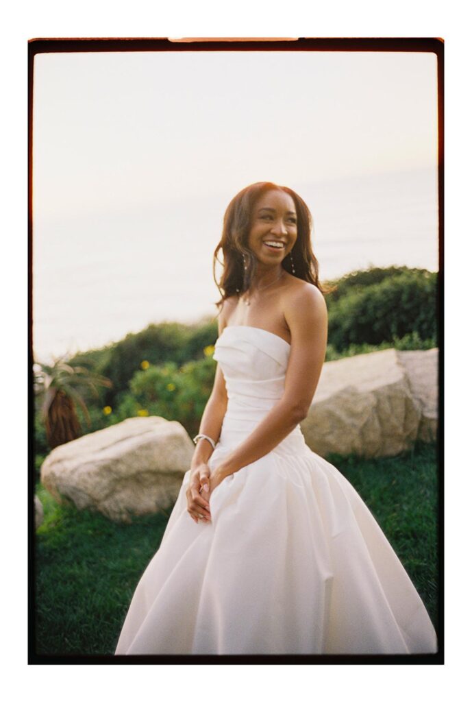 Bride smiling and laughing at big sur cliff wedding