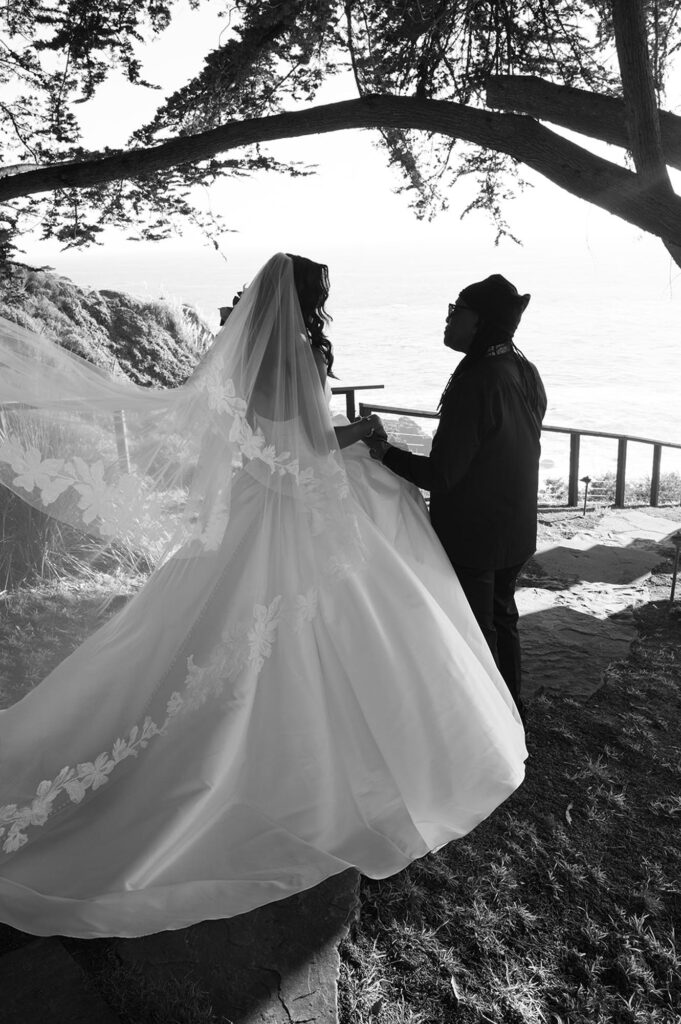 Bride and her father embracing at big sur california wedding