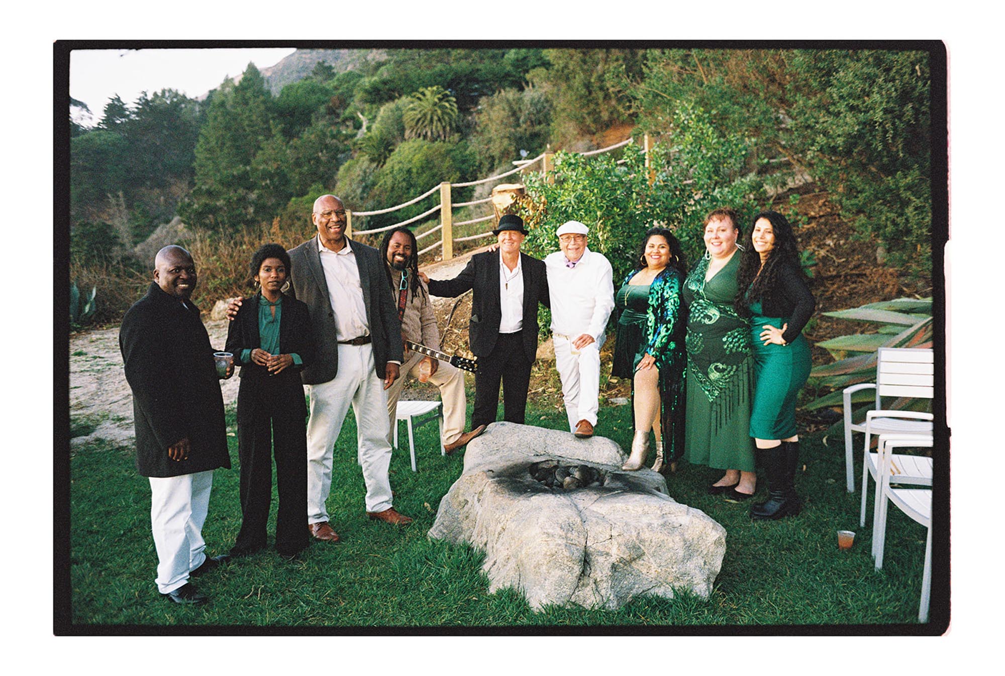 big sur cliff wedding guests all smiling together