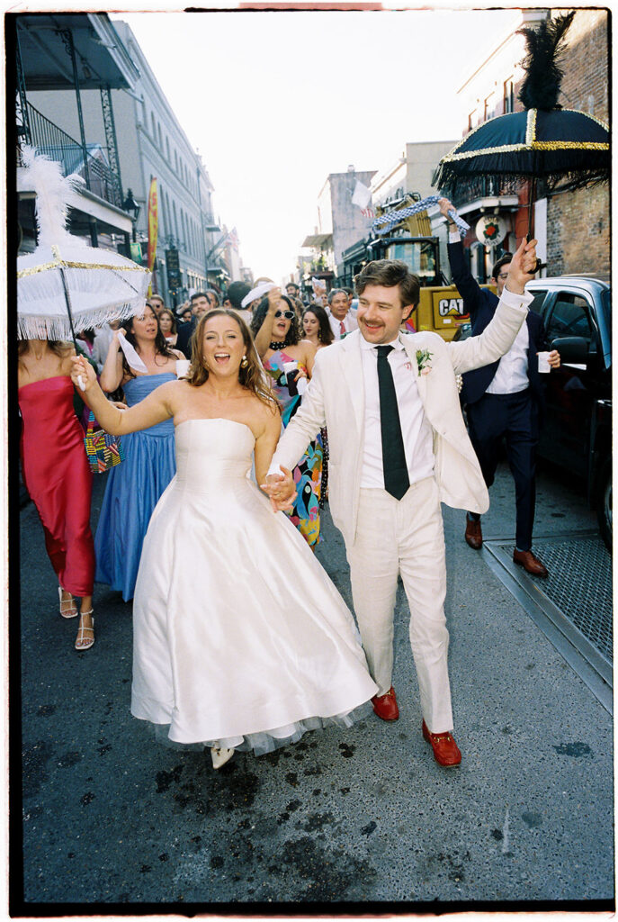 Bride and groom dancing at their new orleans destination wedding at their second line