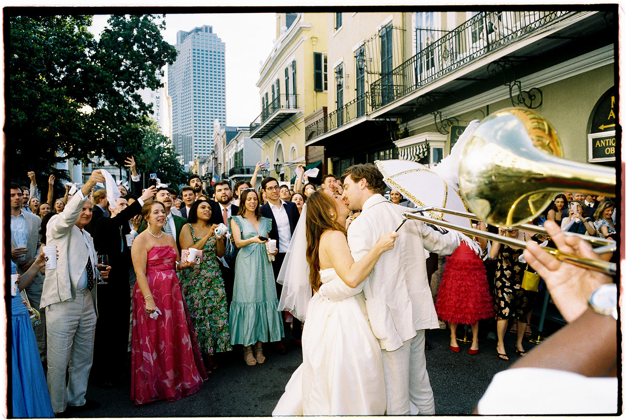 Second line after st mary's new orleans church Ceremony + reception at Brennan's captured by Noble Photo Co